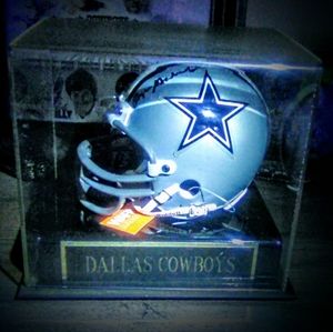 Signed football helmets Rodger Staubach.
